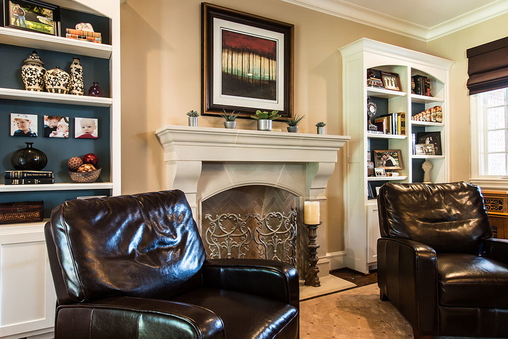 This is an example of a traditional study in Dallas with a standard fireplace and a stone fireplace surround.