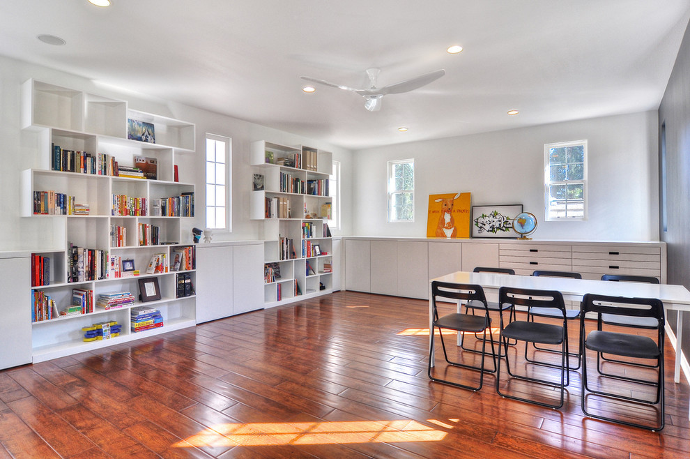 Inspiration for a huge contemporary freestanding desk medium tone wood floor home office remodel in Orange County with white walls and no fireplace