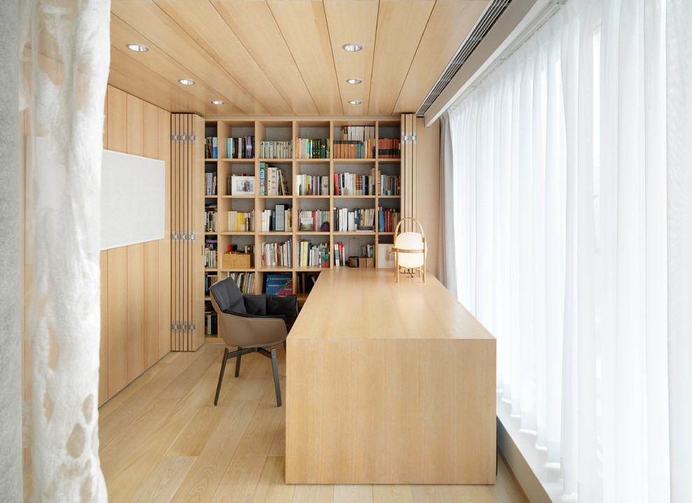 На фото: кабинет среднего размера в восточном стиле с светлым паркетным полом и встроенным рабочим столом с