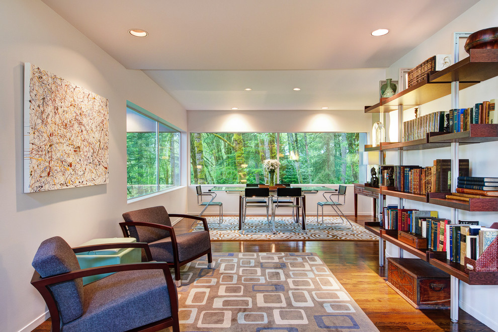 Photo of a large contemporary study in Portland with white walls, medium hardwood flooring and a freestanding desk.