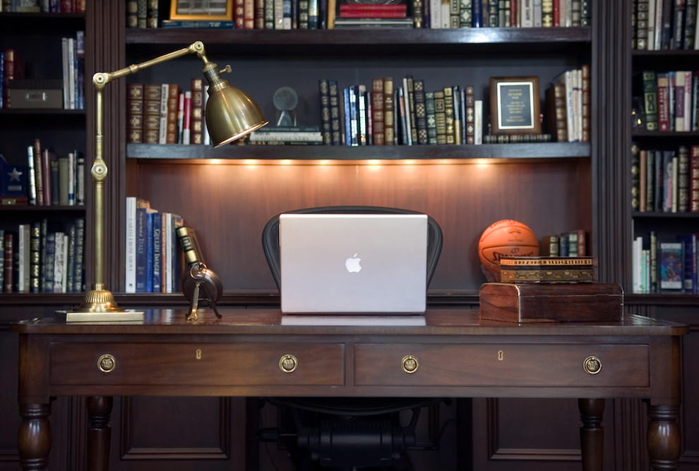 Elegant freestanding desk home office photo in New York