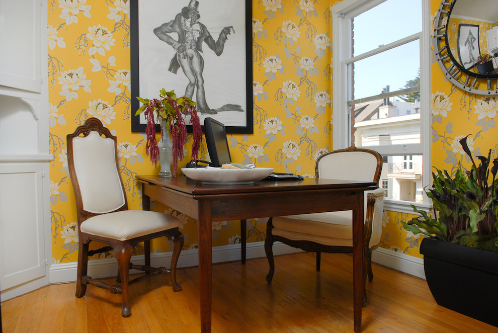Photo of an eclectic home office in San Francisco with yellow walls.