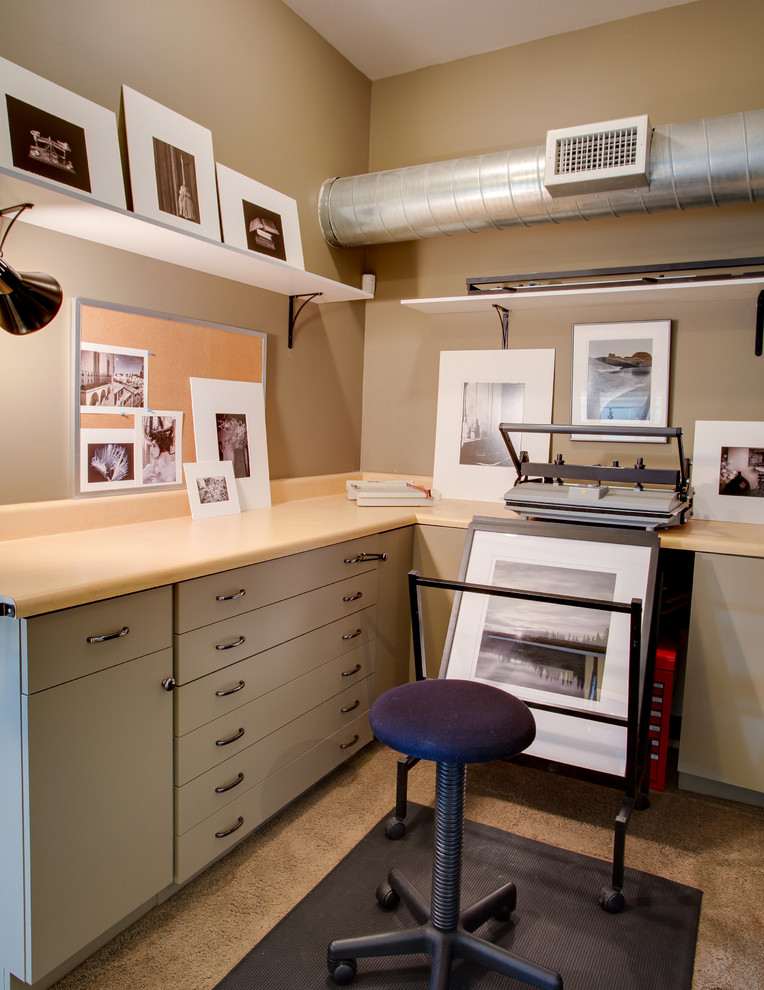 This is an example of a medium sized urban home studio in Phoenix with beige walls, carpet, no fireplace and a built-in desk.