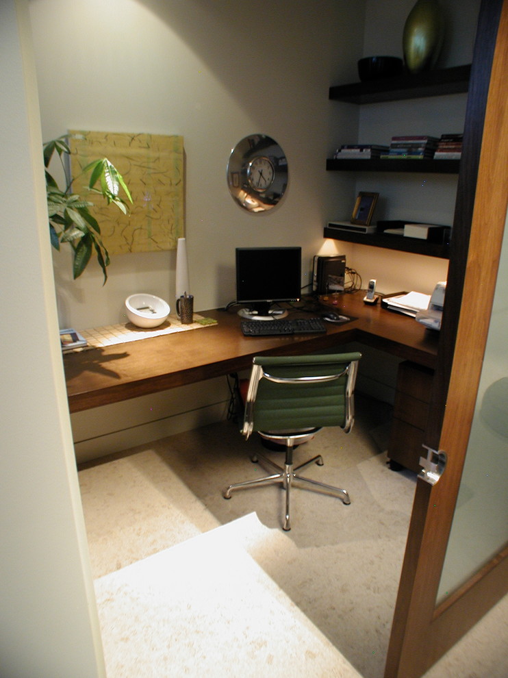 Photo of a small modern home studio in Denver with white walls, a built-in desk and no fireplace.