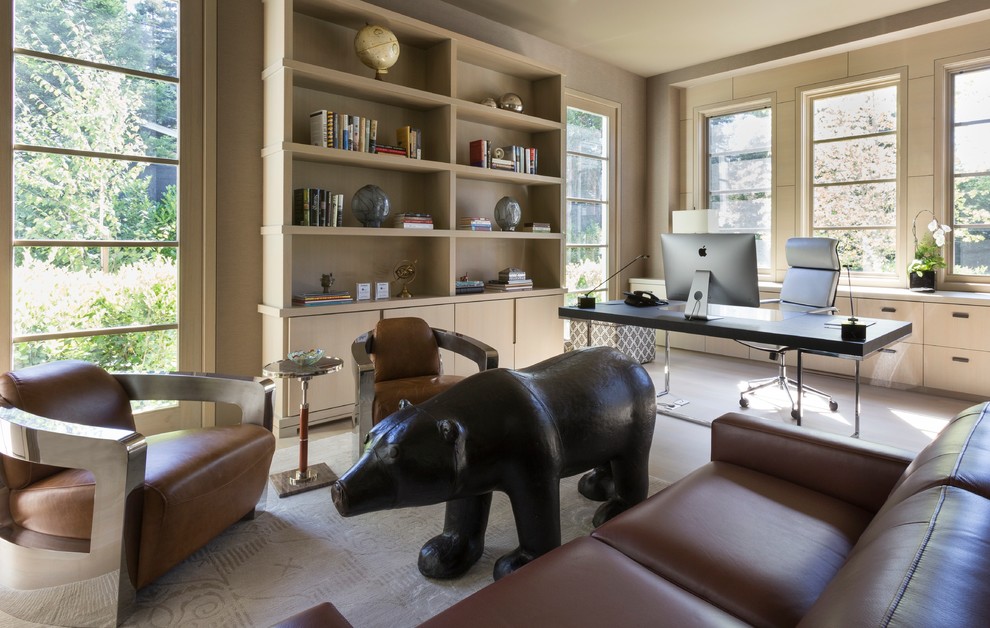 Large contemporary study in San Francisco with beige walls and a freestanding desk.