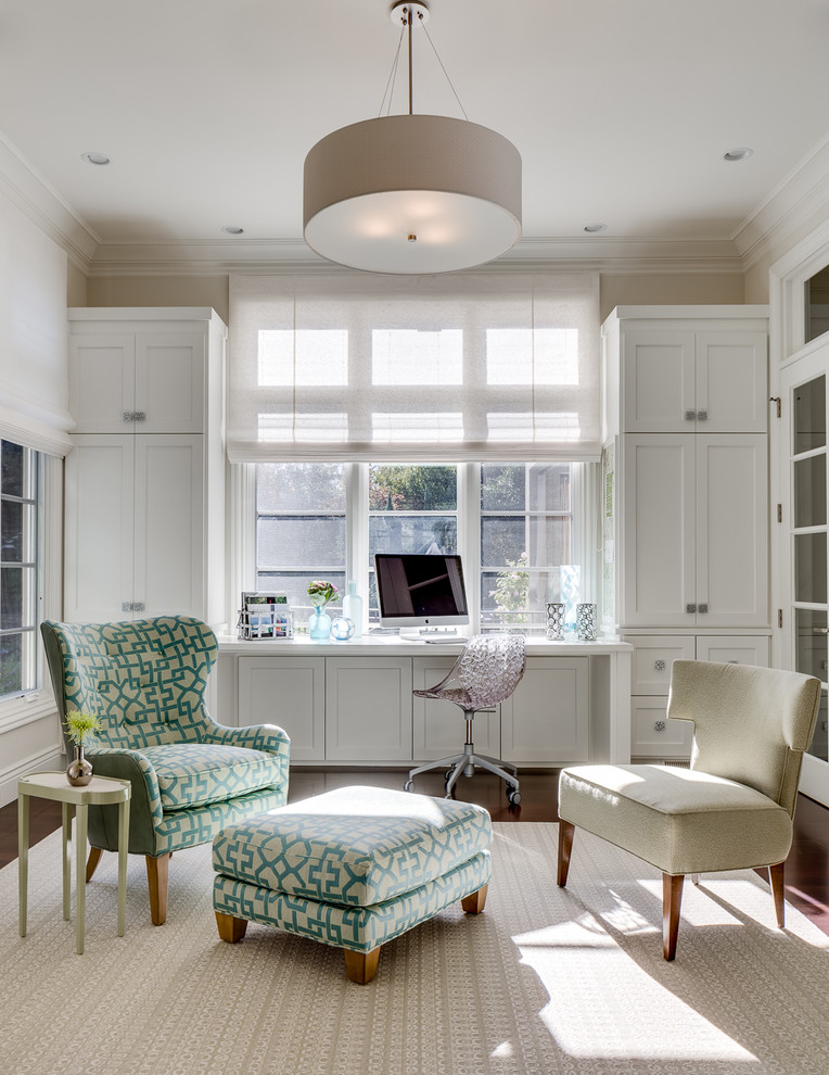 Home office - traditional built-in desk home office idea in San Francisco with beige walls