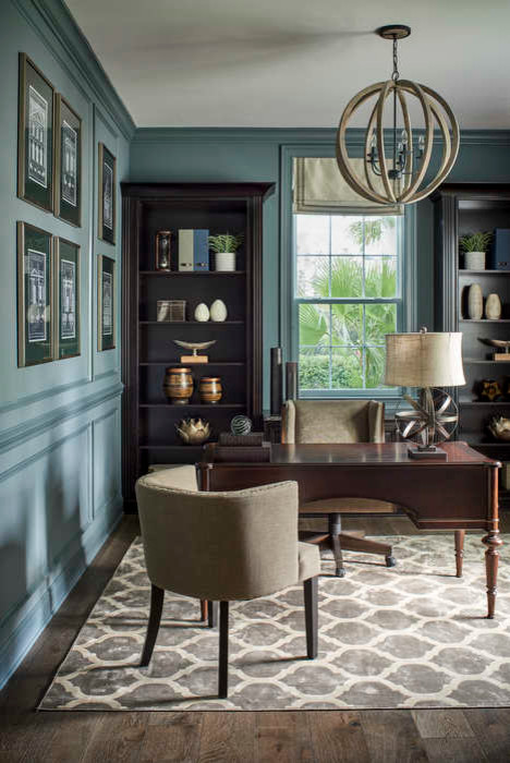Design ideas for a large traditional study in Orlando with blue walls, dark hardwood flooring, no fireplace and a freestanding desk.