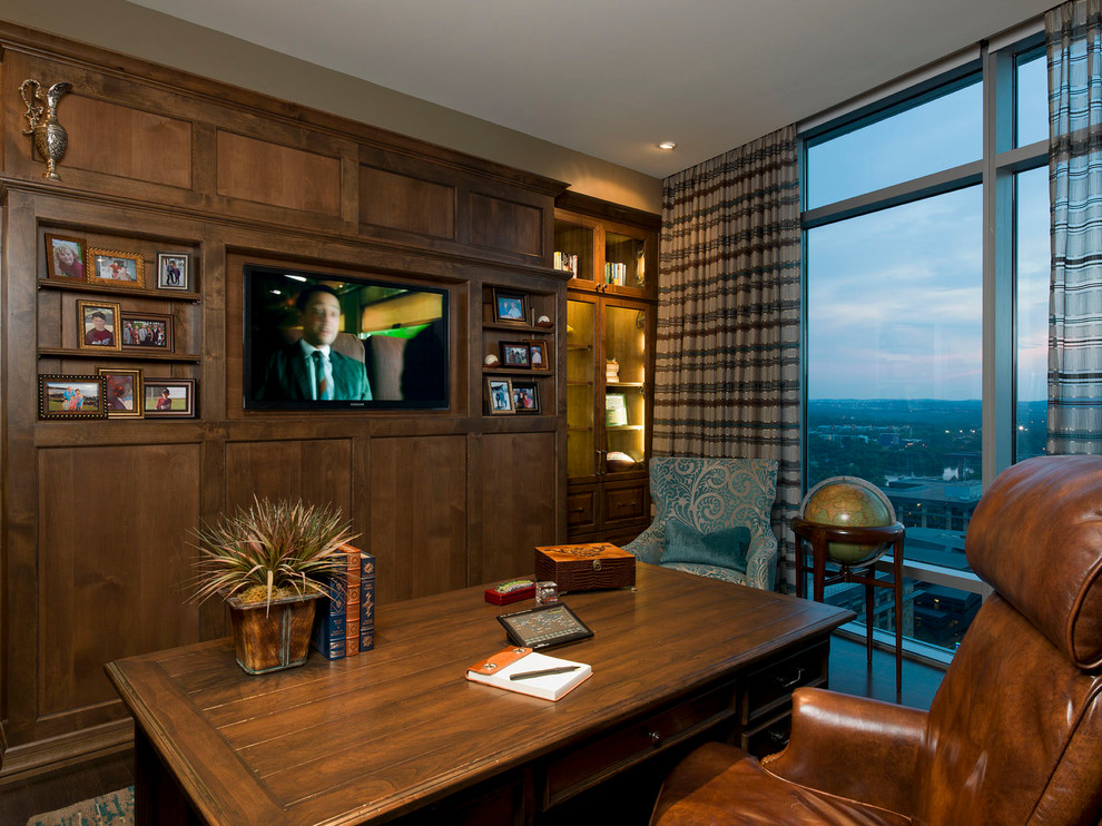 This is an example of a contemporary home office in Austin with a freestanding desk.
