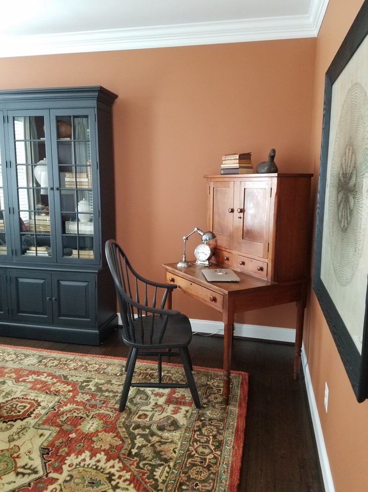 Photo of a medium sized classic home office in DC Metro with dark hardwood flooring and a freestanding desk.