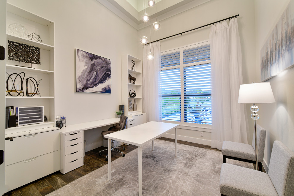 Mid-sized transitional built-in desk porcelain tile, brown floor and tray ceiling study room photo in Other with gray walls