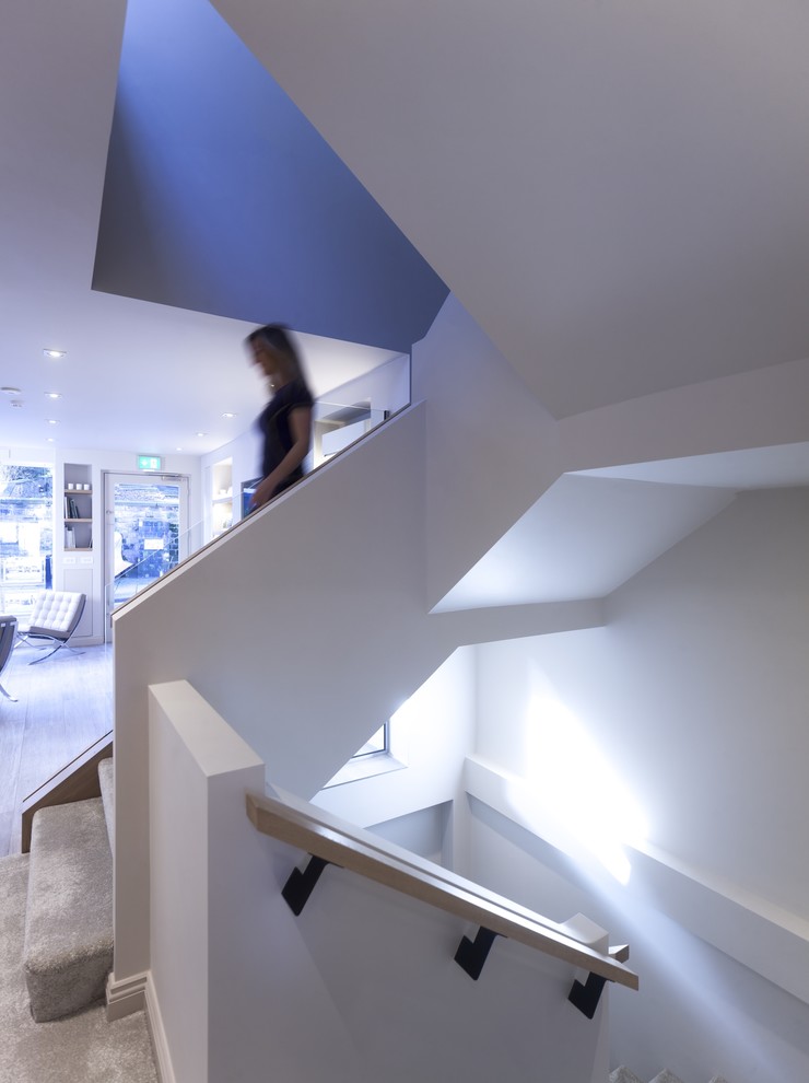 This is an example of a large contemporary staircase in Cheshire.