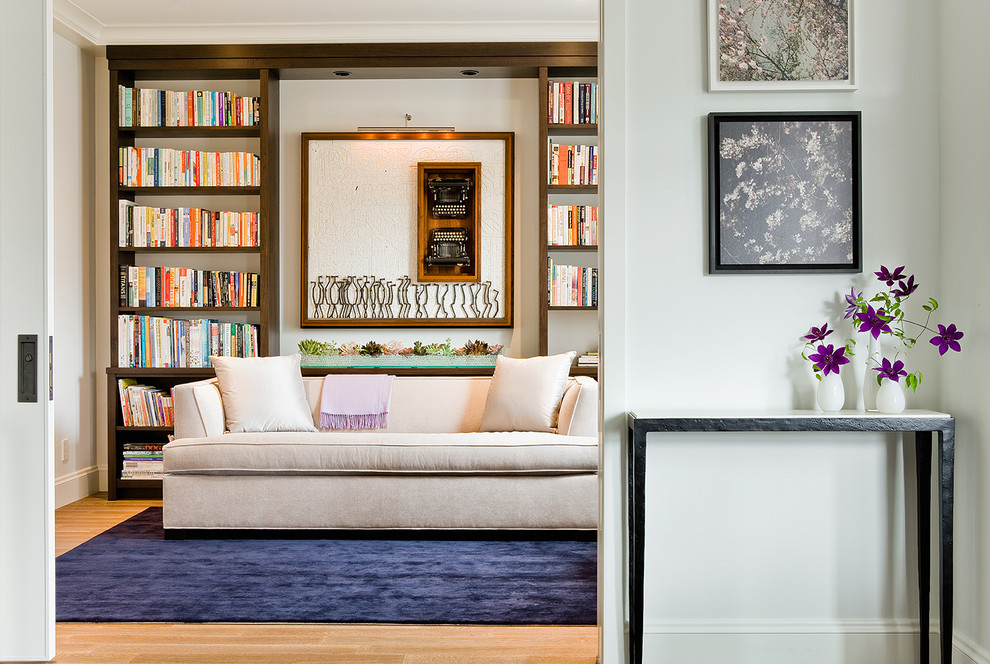 Transitional light wood floor home office photo in Boston with white walls