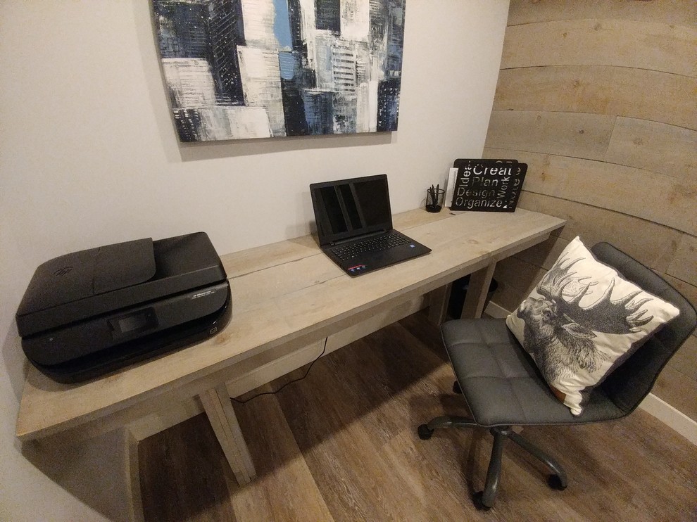 Example of a small trendy built-in desk vinyl floor and multicolored floor home studio design in Toronto with multicolored walls and no fireplace