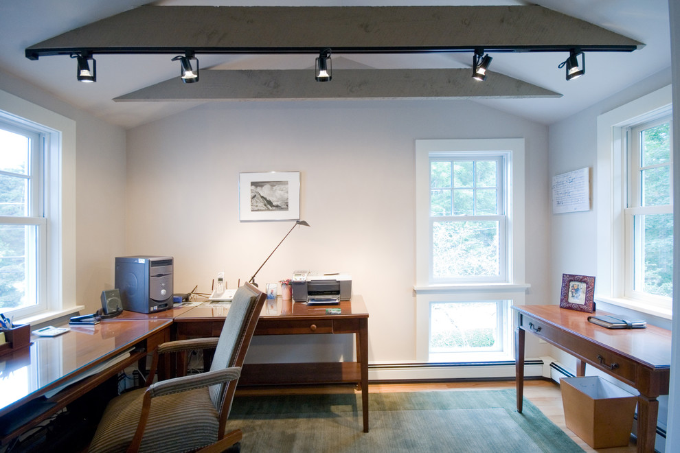 Example of a transitional home office design in Providence