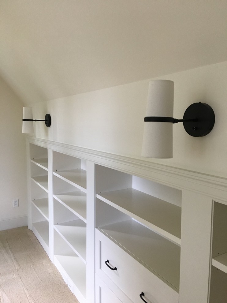 Large nautical study in Seattle with white walls, carpet, no fireplace, a freestanding desk and white floors.