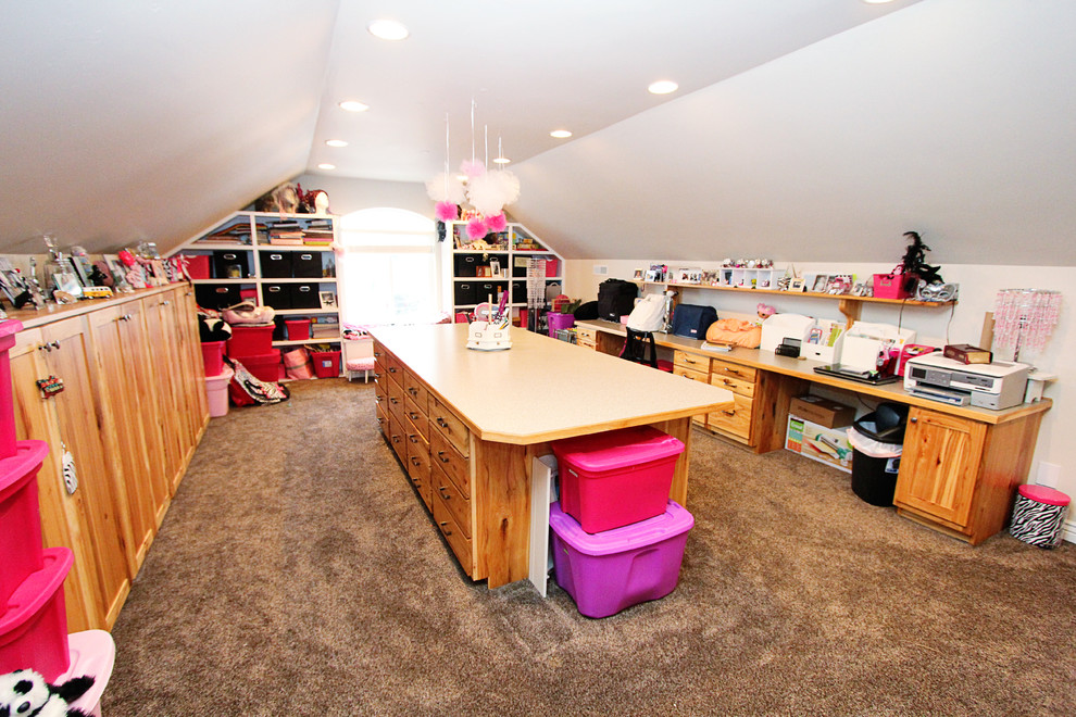 Inspiration for a large classic craft room in Boise with white walls, carpet and a built-in desk.