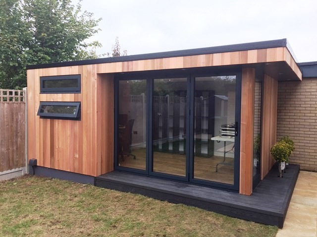 Design ideas for a medium sized contemporary home studio in Cambridgeshire with a freestanding desk.