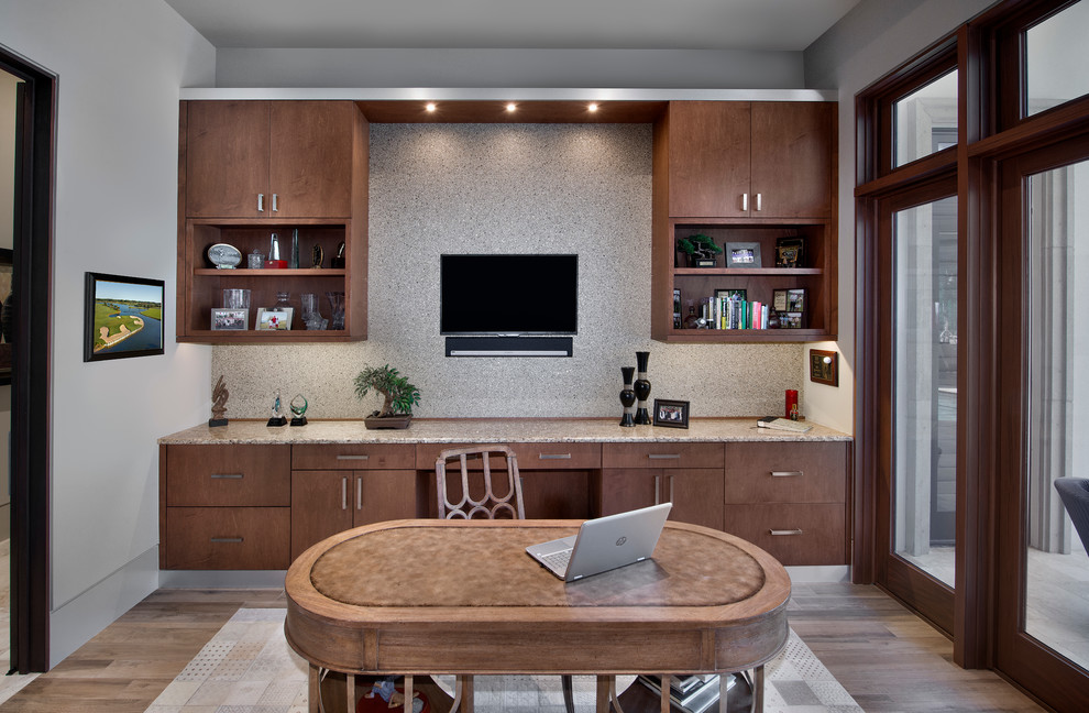 Design ideas for a large contemporary home office in Miami with a built-in desk.