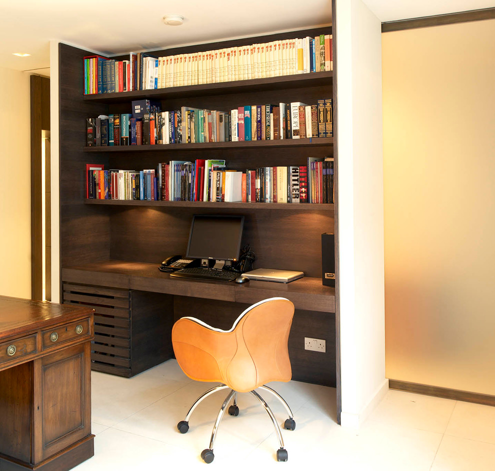 Photo of a contemporary home office in London with a built-in desk.