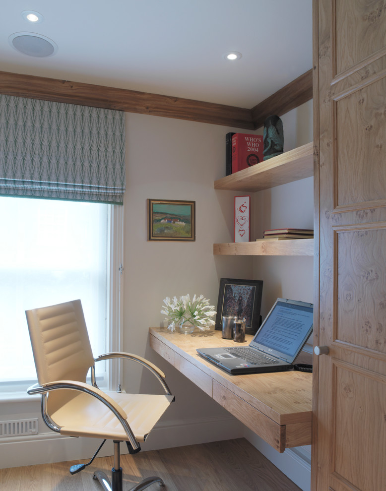 Inspiration for a cottage built-in desk home office remodel in London