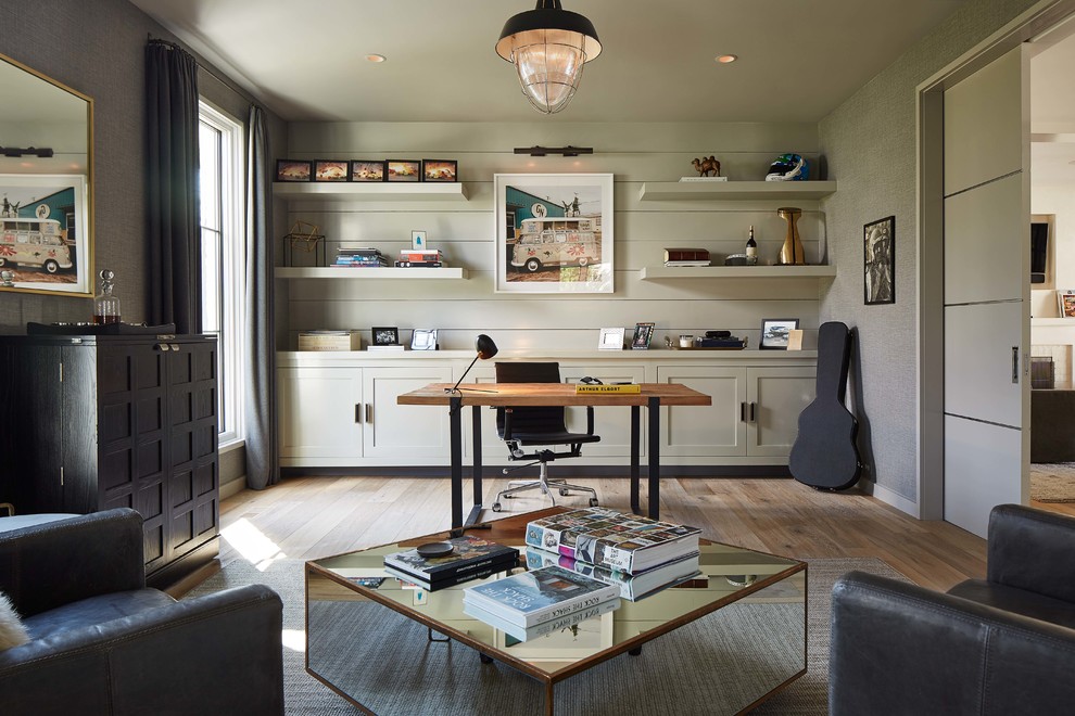 Transitional freestanding desk light wood floor study room photo in Charlotte with gray walls