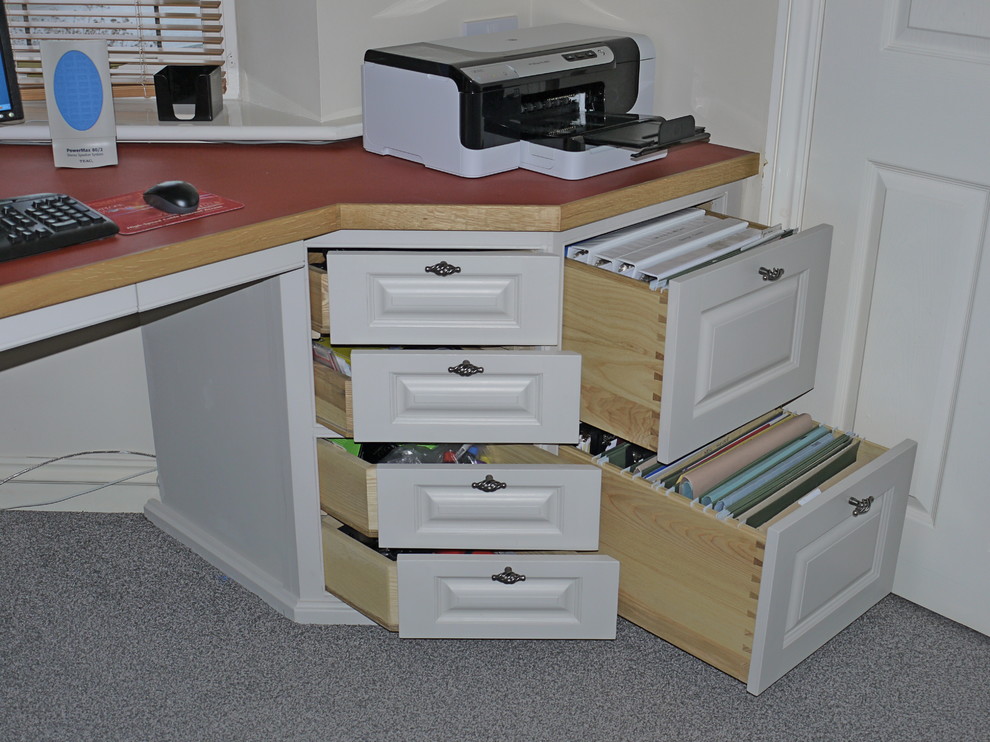 Photo of a medium sized contemporary study in Gloucestershire with beige walls, carpet and a built-in desk.