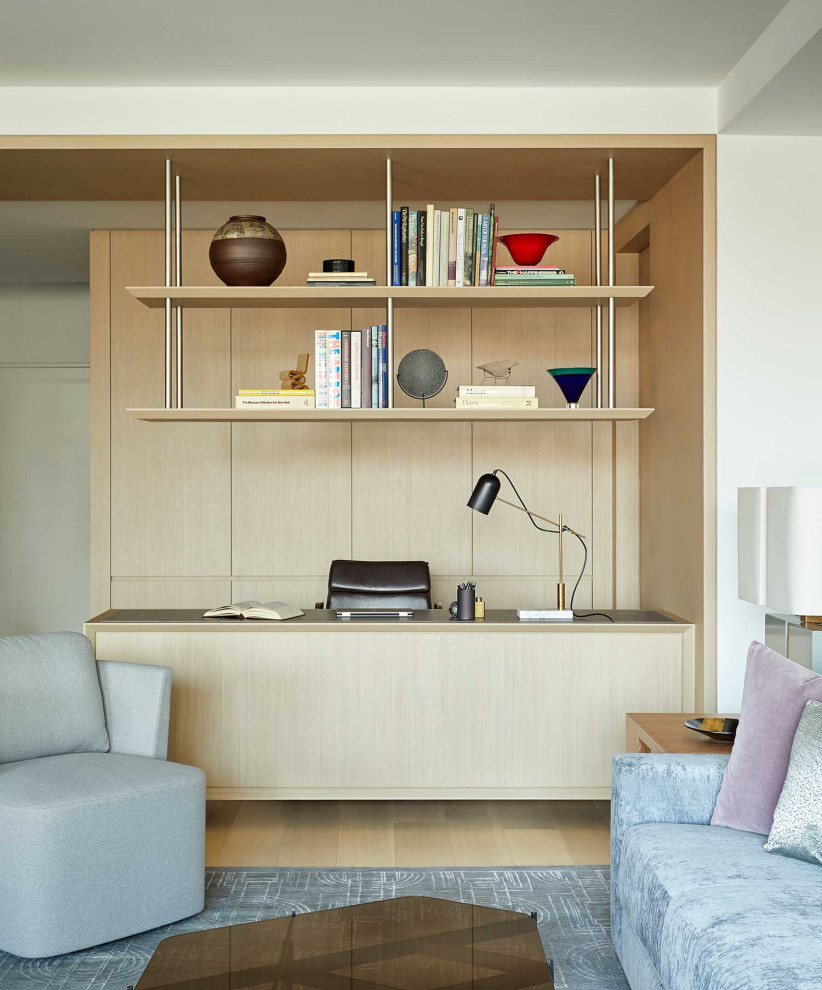Inspiration för ett mellanstort funkis arbetsrum, med vita väggar, mellanmörkt trägolv och ett inbyggt skrivbord
