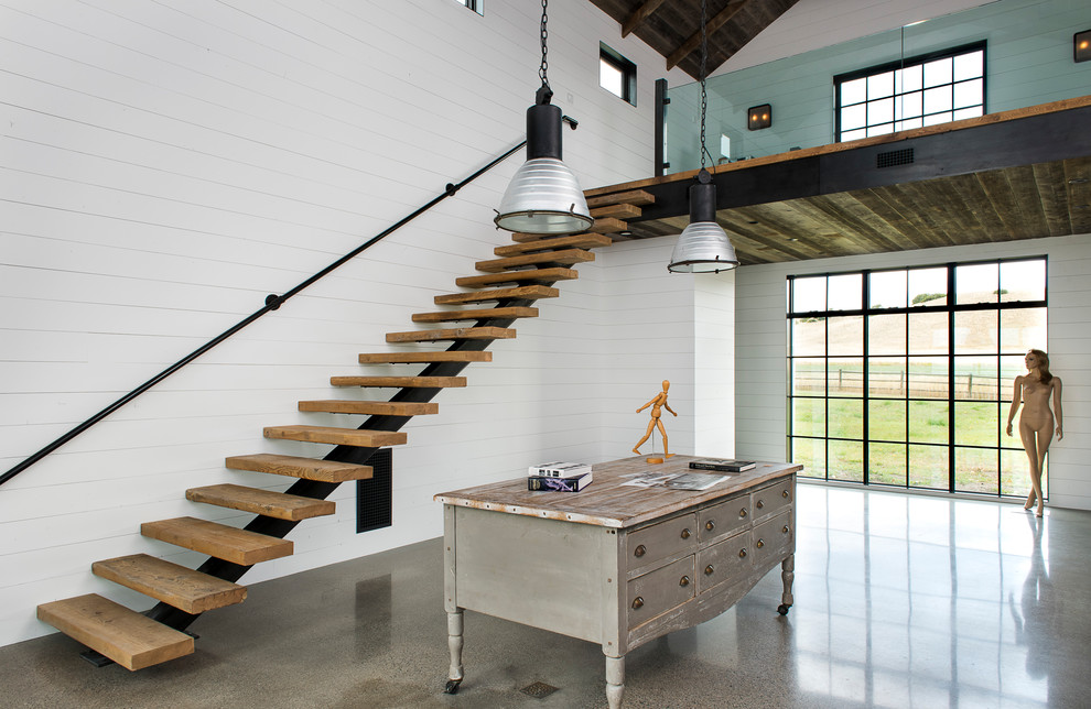 Inspiration för ett mycket stort funkis hemmastudio, med vita väggar, betonggolv och grått golv