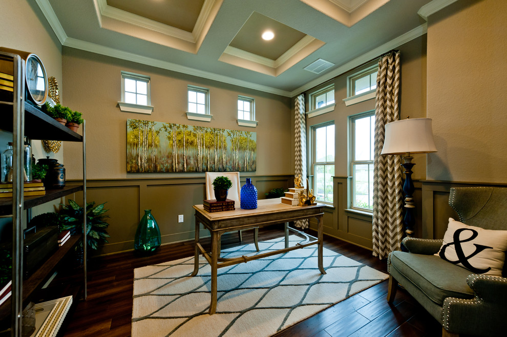 This is an example of a traditional study in Dallas with beige walls, no fireplace, a freestanding desk and a dado rail.