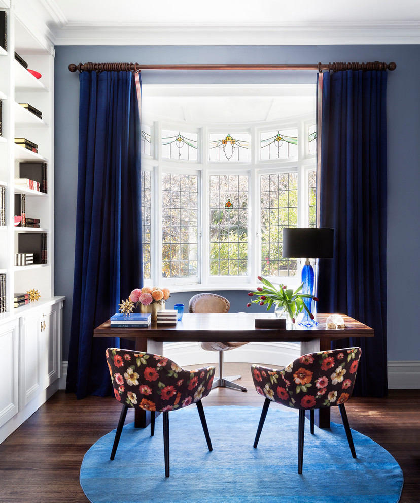 Design ideas for a medium sized eclectic study in Melbourne with blue walls, medium hardwood flooring, a freestanding desk and brown floors.