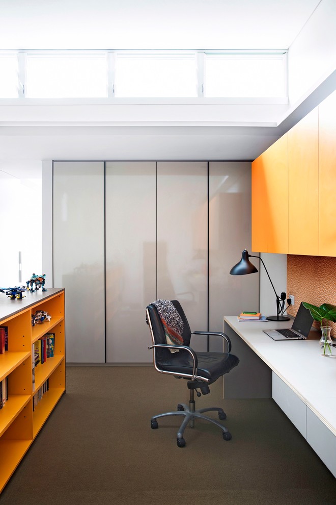 Photo of a medium sized contemporary study in Sydney with white walls, carpet and a built-in desk.