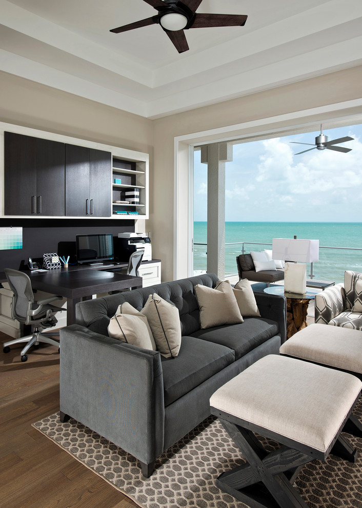 Design ideas for an expansive beach style home office in Miami.