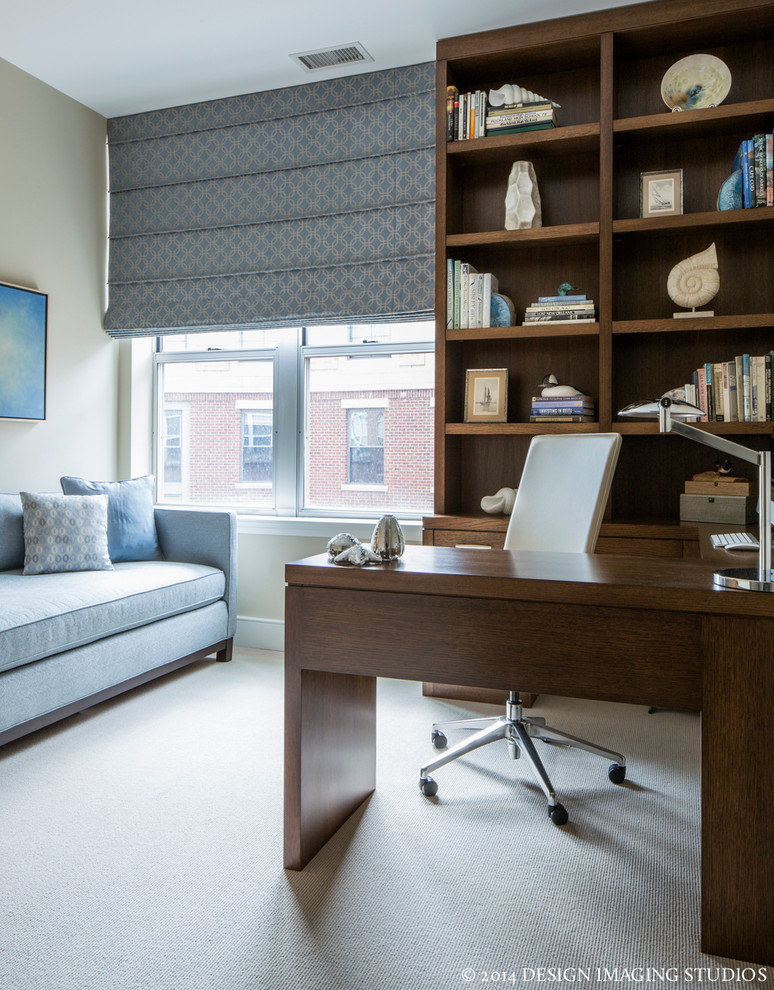 Photo of a traditional study in Boston with beige walls, carpet and a built-in desk.