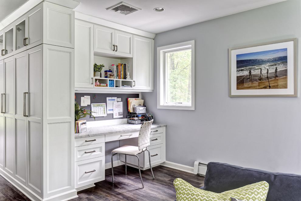 Inspiration for a large classic home office in New York with porcelain flooring, brown floors, grey walls and a built-in desk.