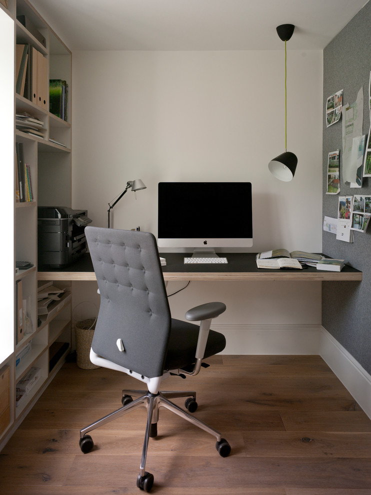 Example of a trendy home office design in Sussex