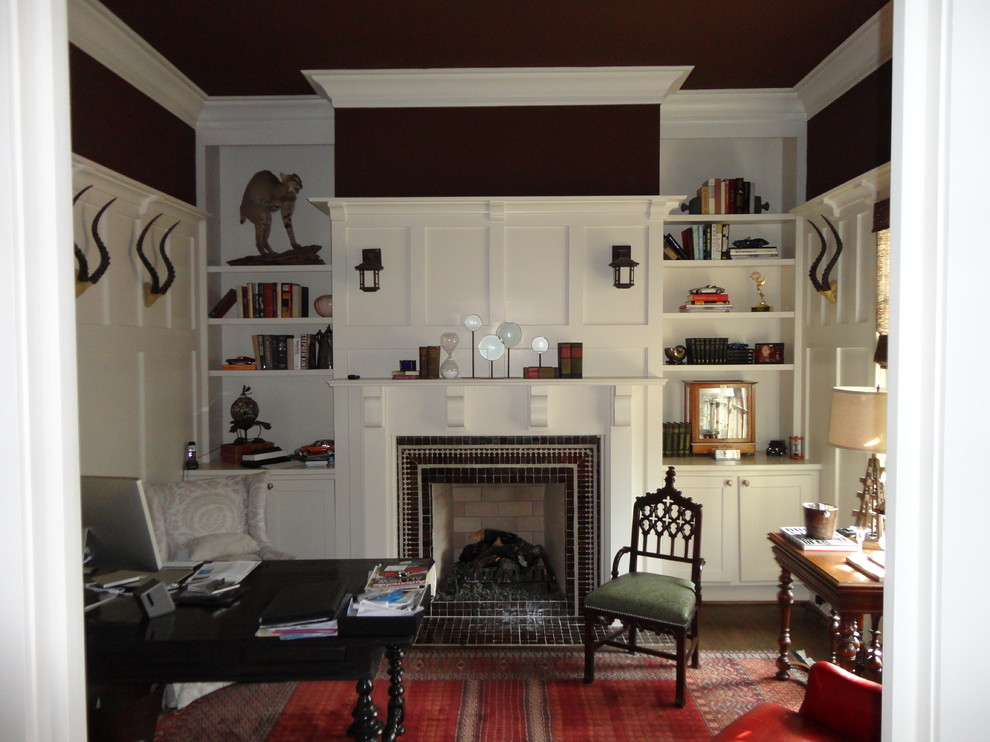 Inspiration for a mid-sized timeless freestanding desk carpeted study room remodel in Atlanta with black walls, a standard fireplace and a tile fireplace