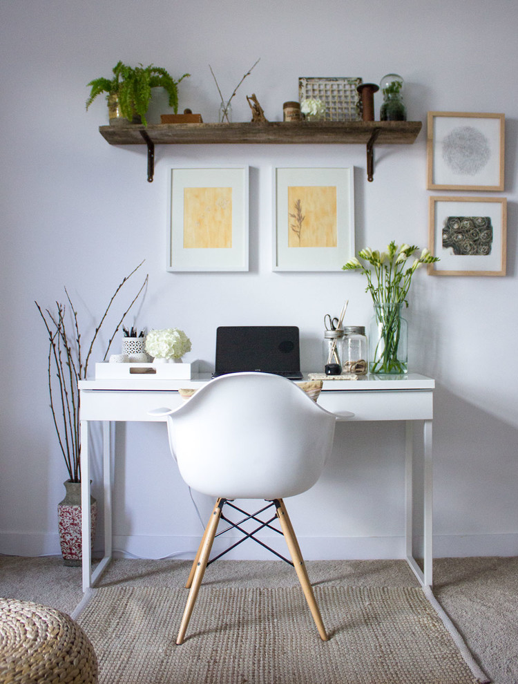 Example of a small minimalist freestanding desk carpeted home office design in Toronto with white walls