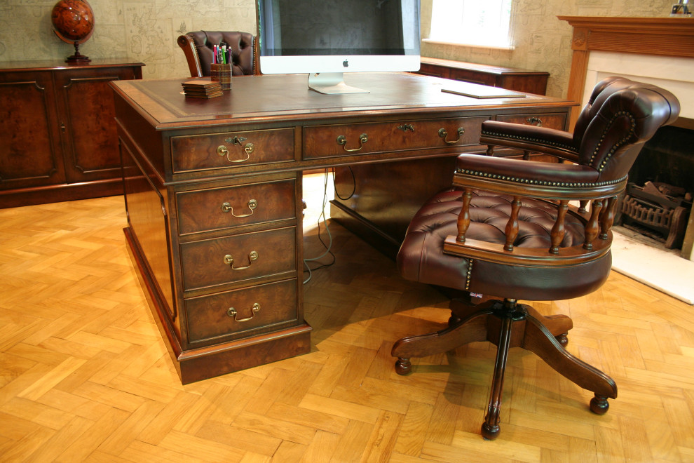 This is an example of a traditional home office in Hampshire.