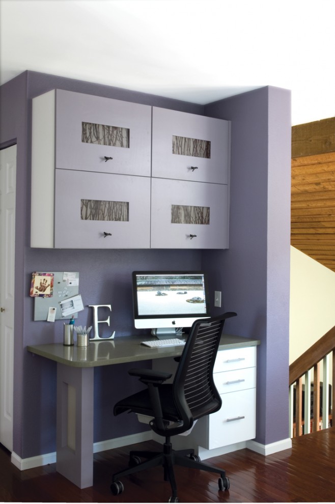 This is an example of a contemporary home office in Denver with purple walls.