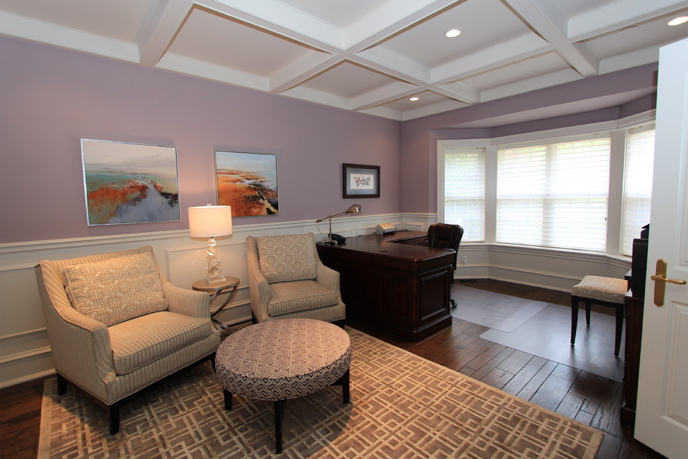 This is an example of a large contemporary study in Toronto with purple walls and a freestanding desk.