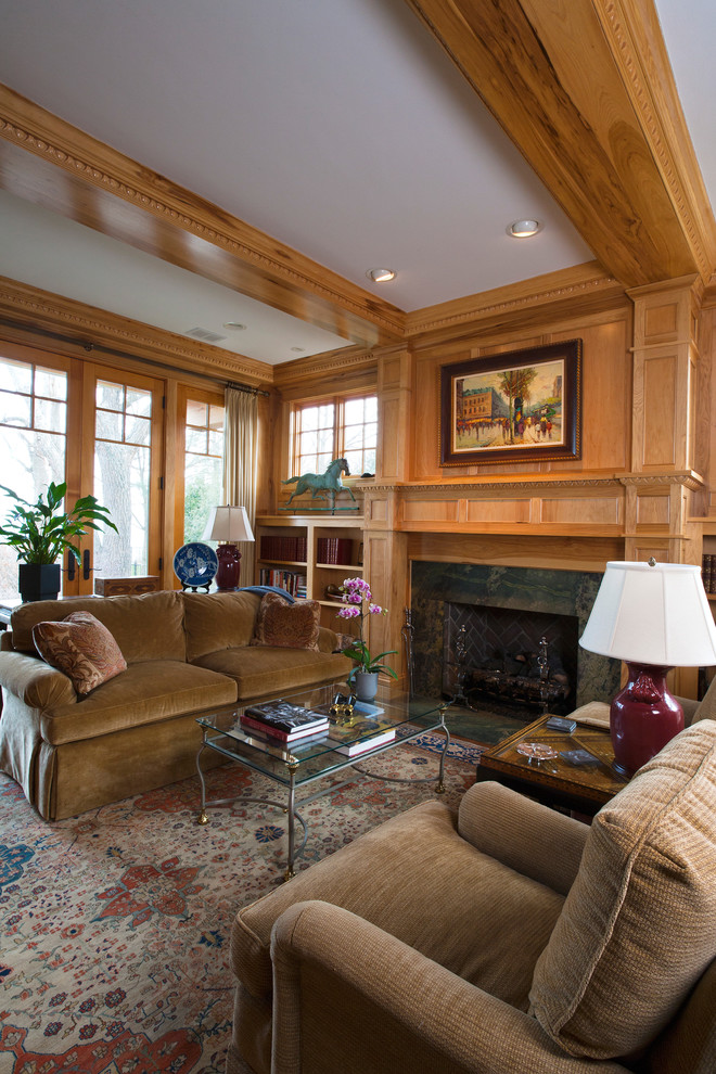 Example of a huge classic medium tone wood floor home office design in Chicago with a standard fireplace and a stone fireplace