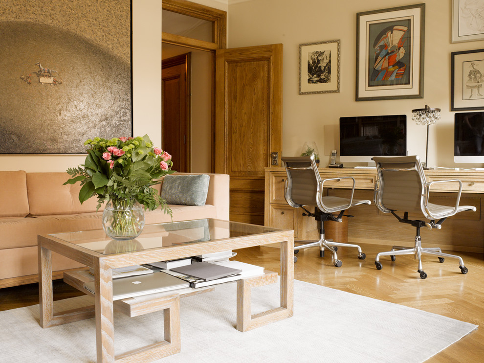 Study room - mid-sized transitional built-in desk medium tone wood floor and beige floor study room idea in New York with beige walls and no fireplace
