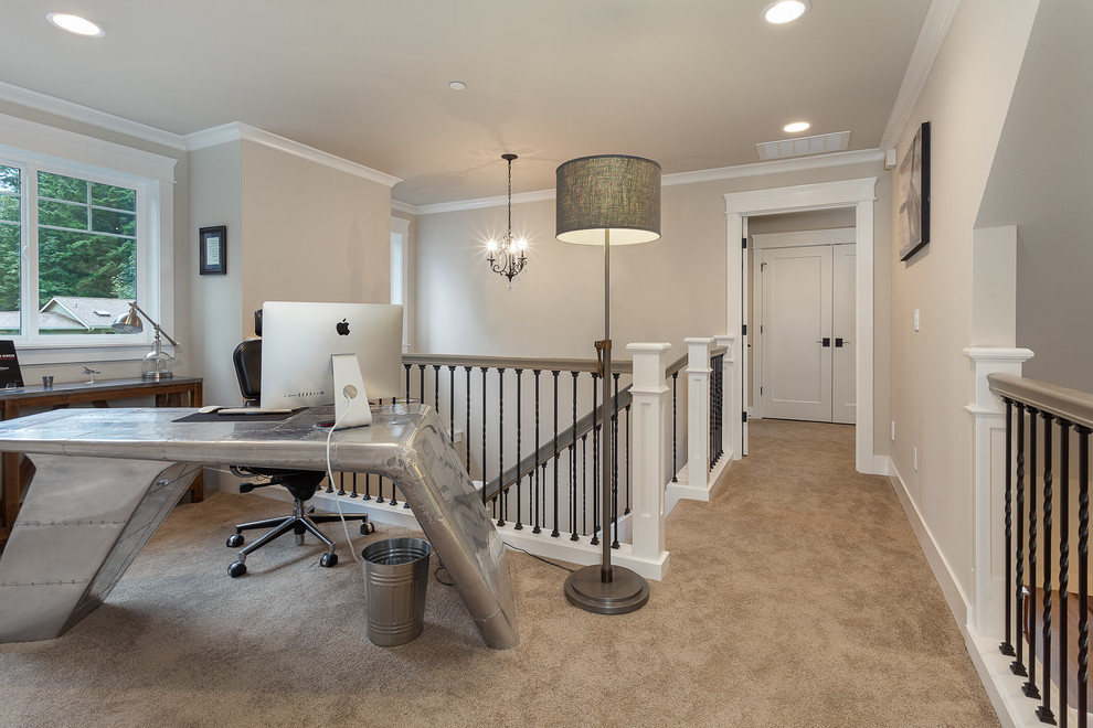 This is an example of a contemporary home office in Boston with carpet, a freestanding desk and beige floors.