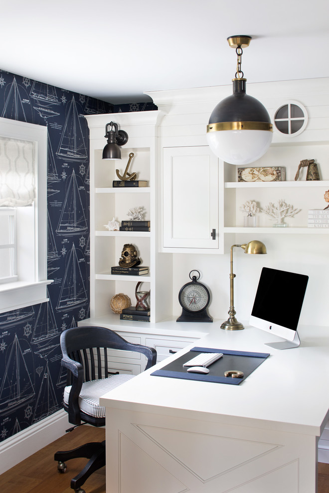 Example of a small beach style built-in desk medium tone wood floor and brown floor home office design in Miami with blue walls and no fireplace