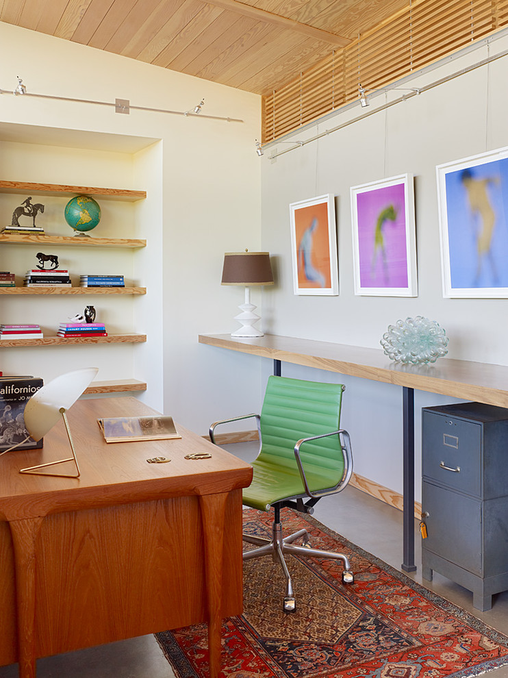 Trendy freestanding desk home office photo in San Francisco with white walls