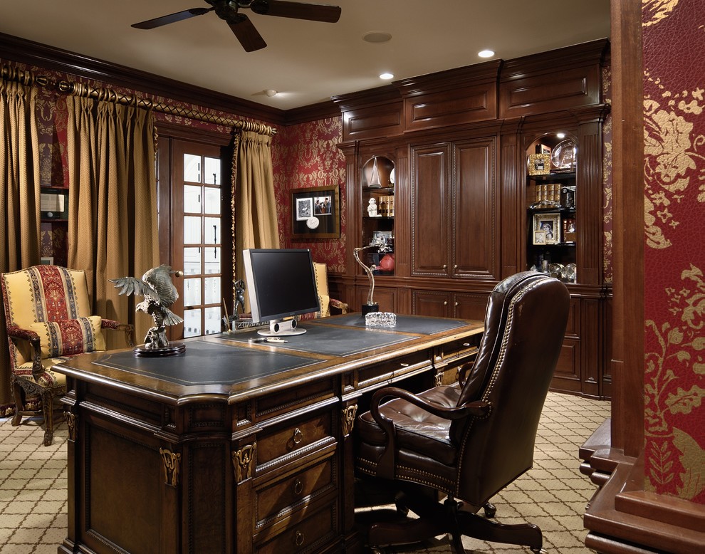 Inspiration for a medium sized victorian study in Charlotte with carpet, a freestanding desk, red walls, beige floors and a dado rail.