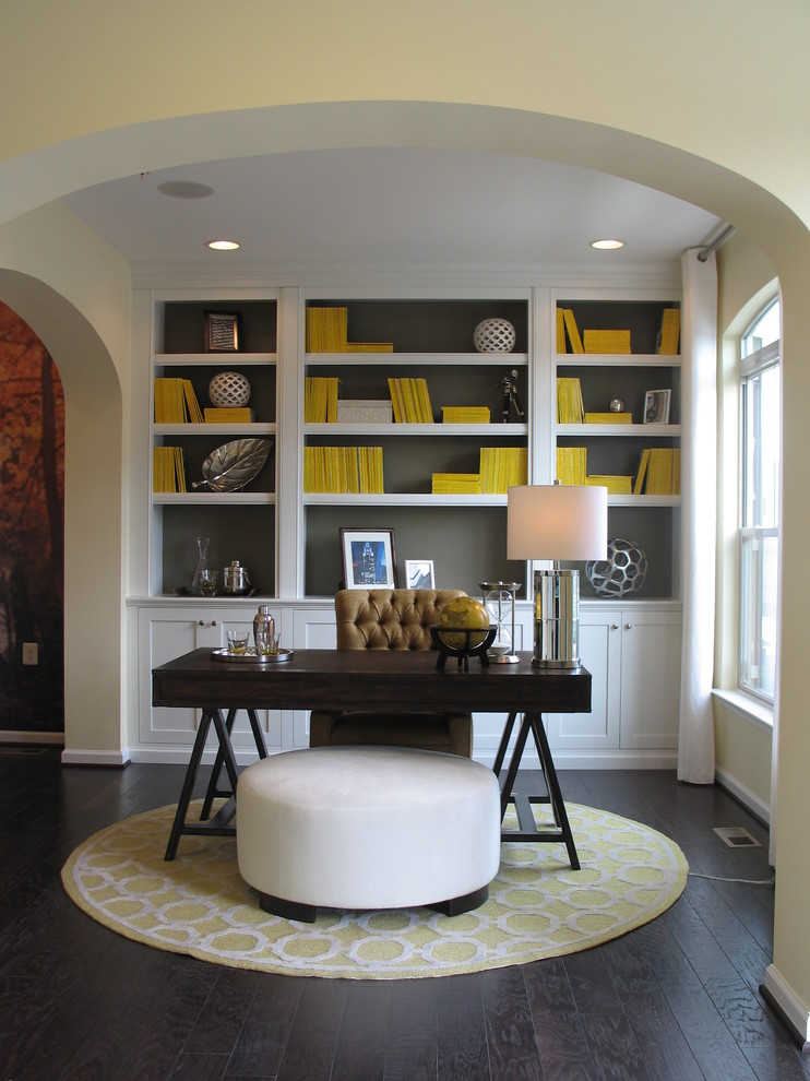 Inspiration for a mid-sized transitional freestanding desk dark wood floor home office remodel in DC Metro with gray walls