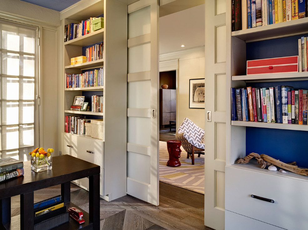 Home office library - mid-sized eclectic freestanding desk dark wood floor and brown floor home office library idea in Denver with white walls and no fireplace