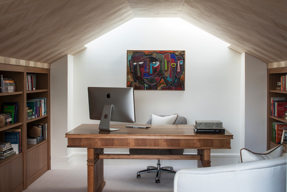 This is an example of a small contemporary home office in London with a freestanding desk.