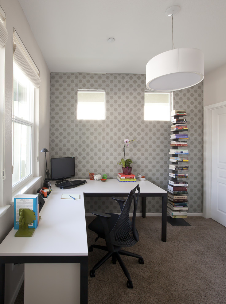 Photo of a medium sized contemporary home office in San Francisco with carpet, a freestanding desk, multi-coloured walls, no fireplace and grey floors.